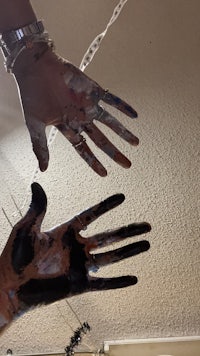 a pair of hands with paint on them